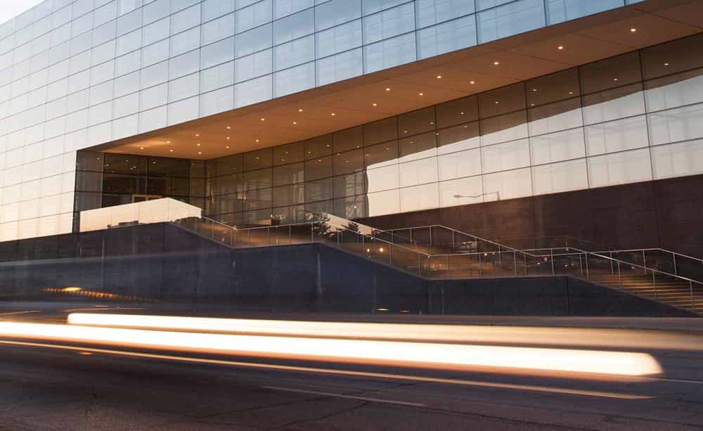 An image of an office building entrance at dusk