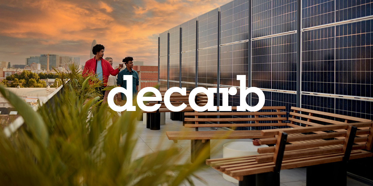 An image of a group of people standing on the roof of a commercial building
