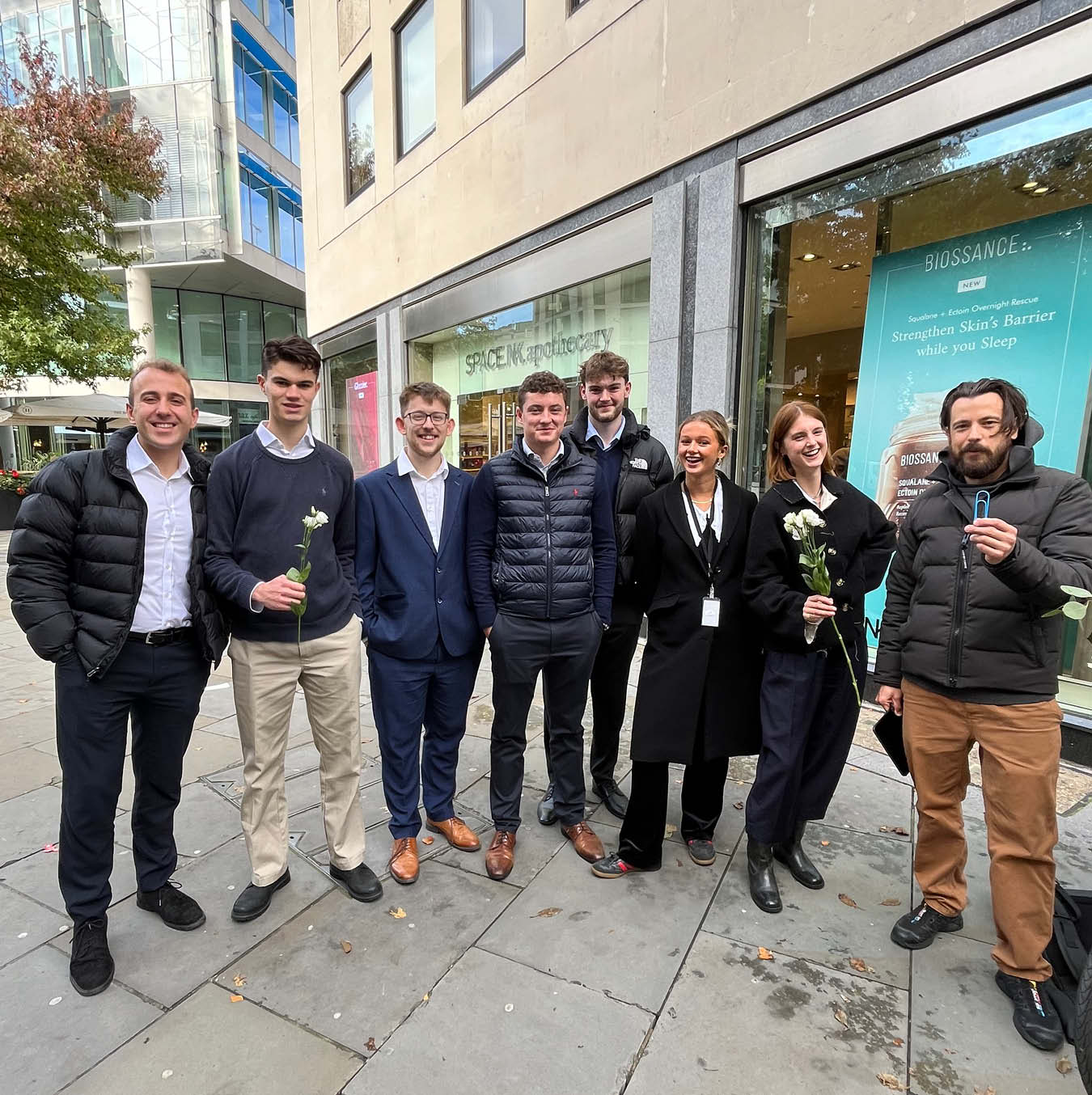 A group of Avison Young staff standing on the street in London