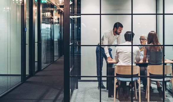Team collaborating in meeting room at the office