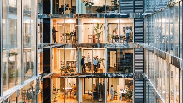 Modern multi-story office building showcasing various professionals