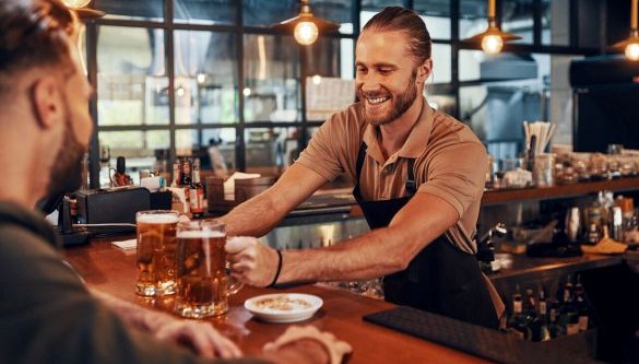 Barista serving customer in café