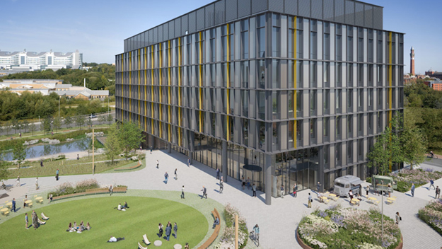 Modern glass office and life sciences building with yellow accents beside a circular green park. People stroll and relax under a clear blue sky, creating a lively, welcoming atmosphere.