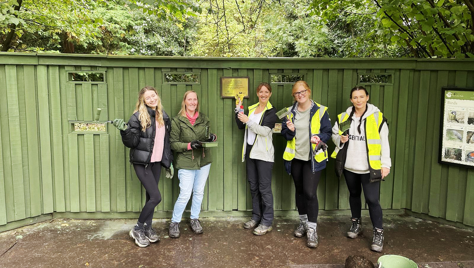 Group of Avison Young employyes during Day of Giving maintaining local green space