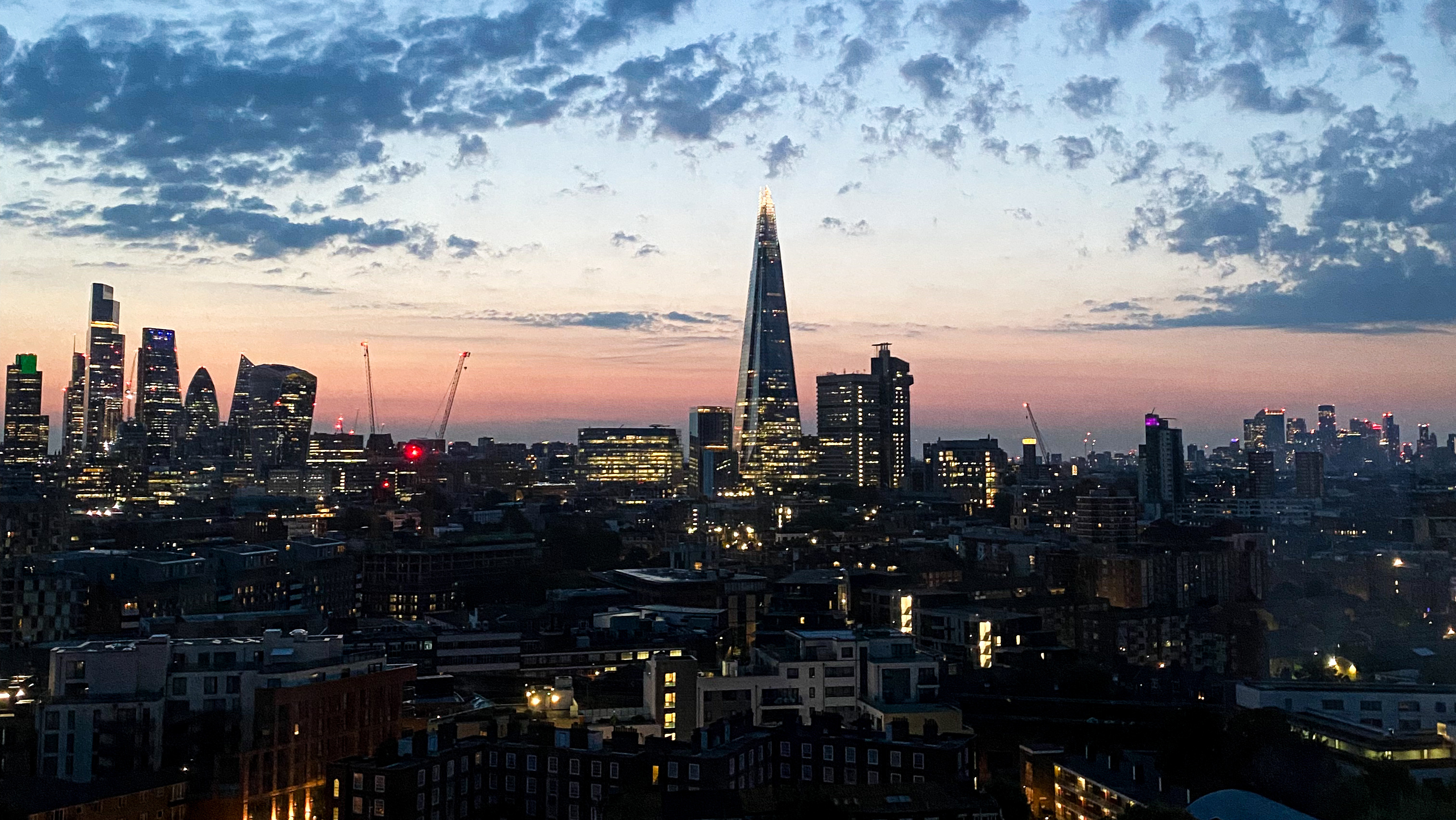skyline at sunset of the city of London including The Shard