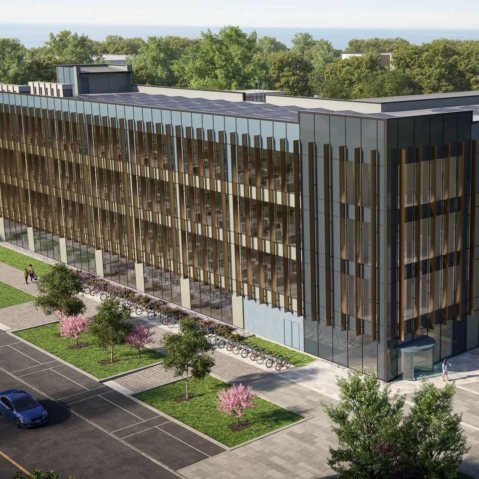 CGI image of modern office building with green area outside on a science and innovation park