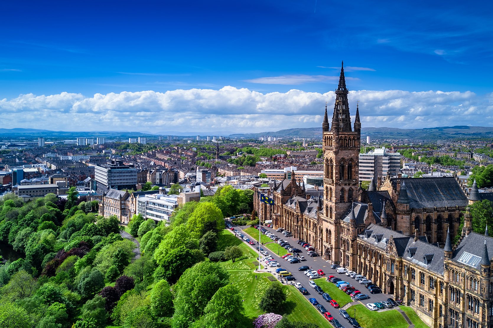 Glasgow University with park lance and commercial property in the background red sandstone facade and city vista