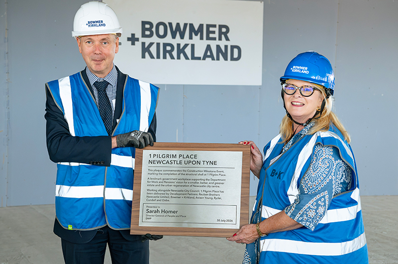 Staff celebrating the construction milestone at 1 Pilgrim Place