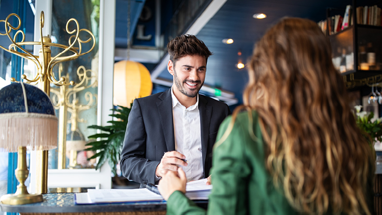 thotel-receptionist-assisting-guest-for-checking-in-