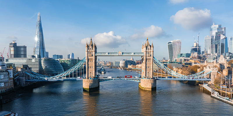 An aerial image of London Bridge with the London skyline in the distance