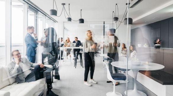 busy-modern-office-with-employees-working-and-interacting-in-a-bright-open-plan-space
